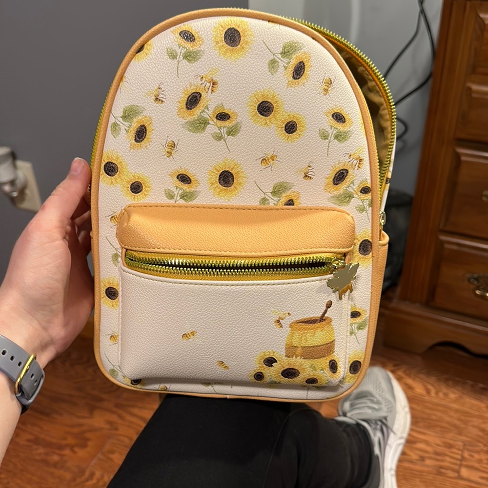 Leather like material. Small backpack purse with sunflower and honeybee design